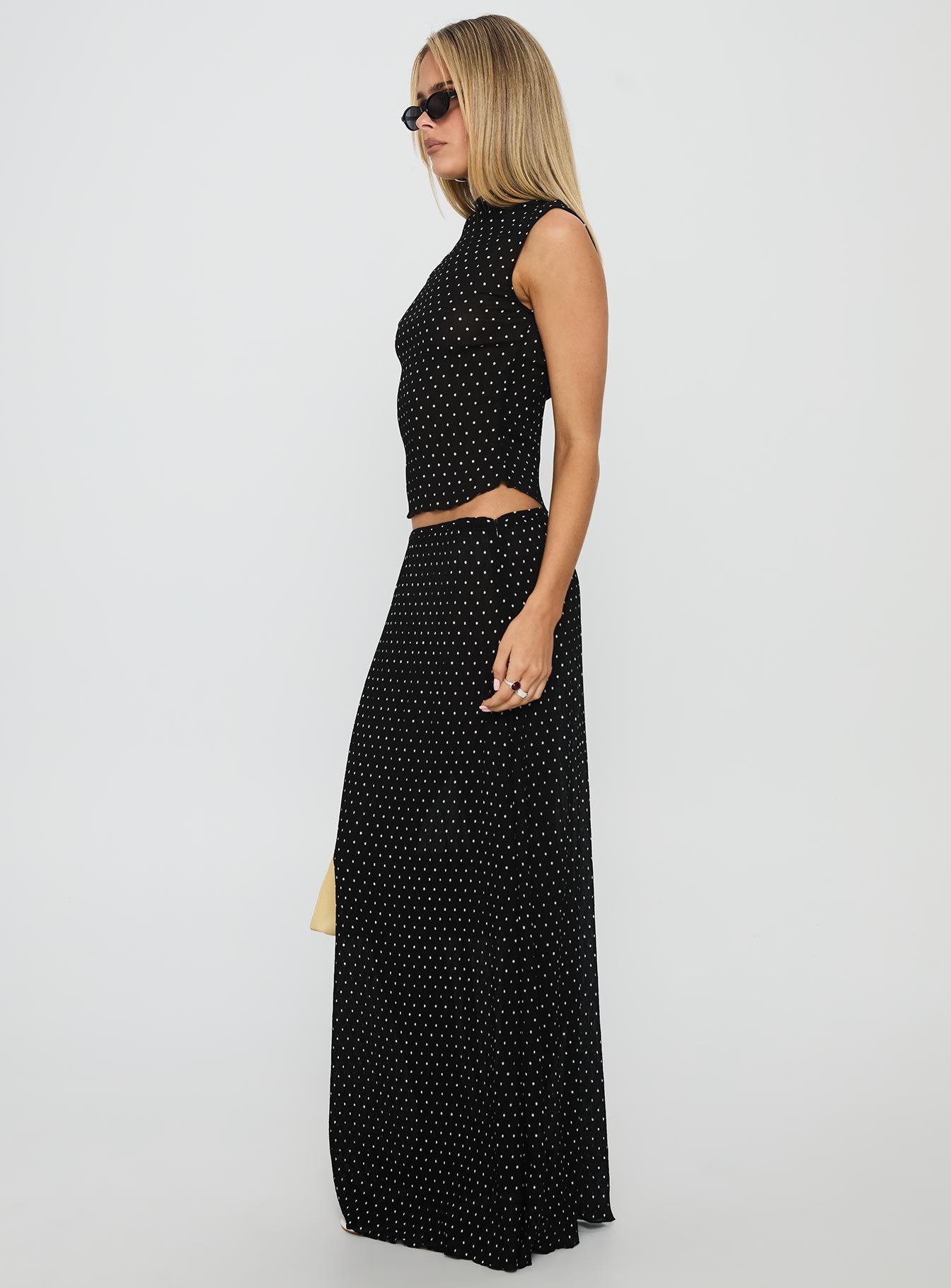   side view of model wearing Princess Polly Ford Maxi Skirt Onyx Polka Maxi 
