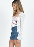   side view of model wearing Princess Polly Zakai Cargo Mini Skirt Mid Wash Denim Tall Mini Skirts 