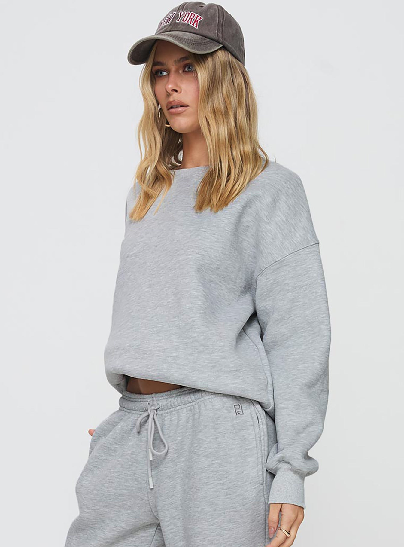 side view of model wearing Princess Polly Dream Fleece Classic Crewneck Sweatshirt Grey Marle 