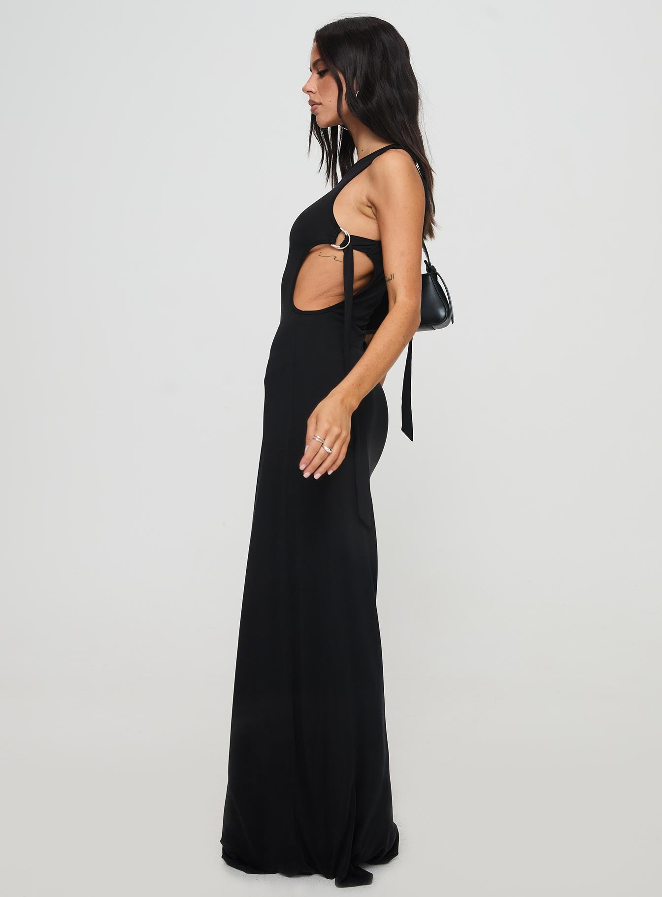 side view of model wearing Princess Polly Trail Blazer Asymmetrical Maxi Dress Black Asymmetric Neckline 