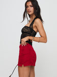 side view of model wearing Princess Polly Gigi Lace Skort Red High Waisted Shorts 