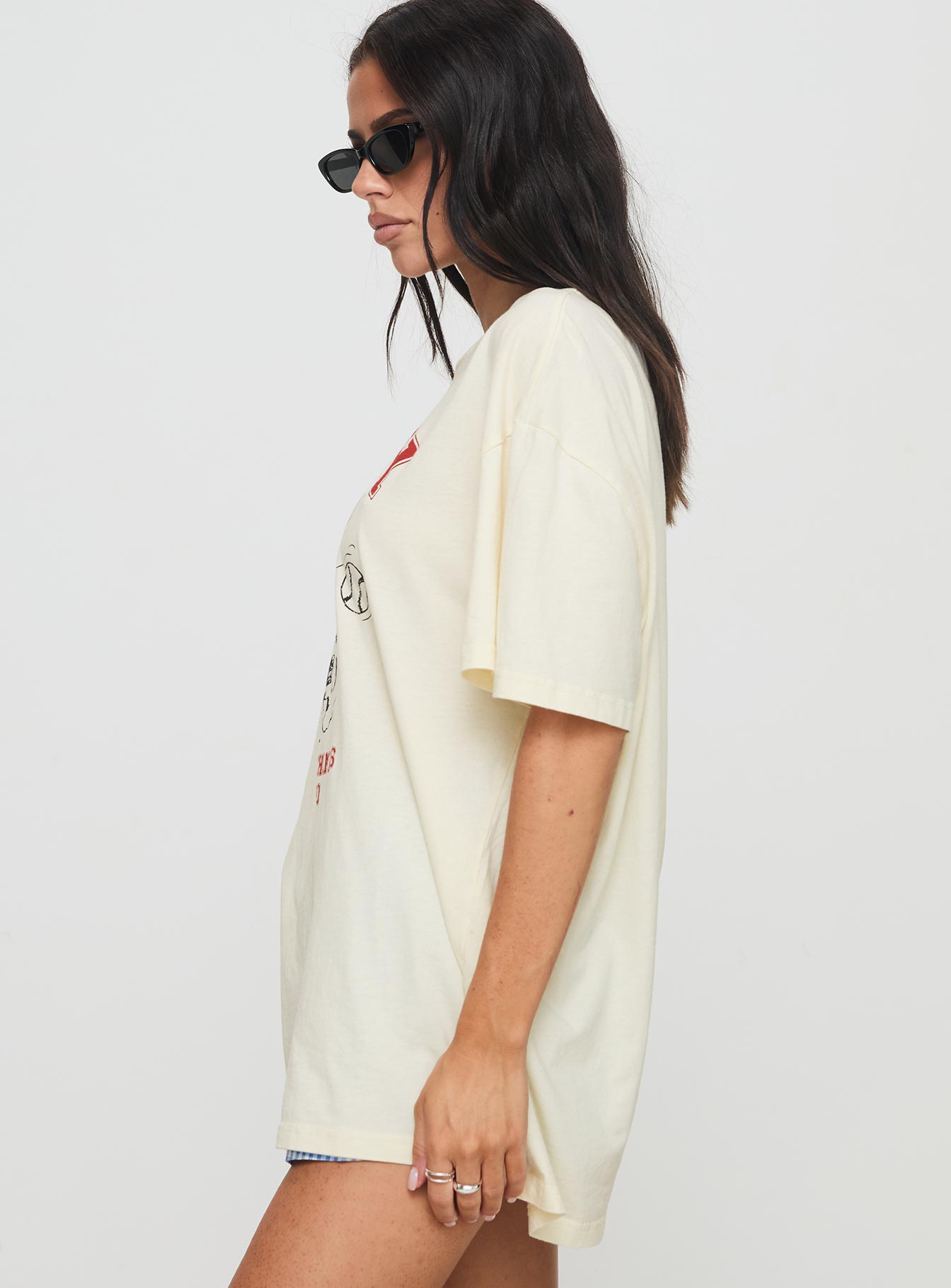 side view of model wearing Princess Polly Snoopy Championship Oversized Tee White Half Sleeves Crew Neck 