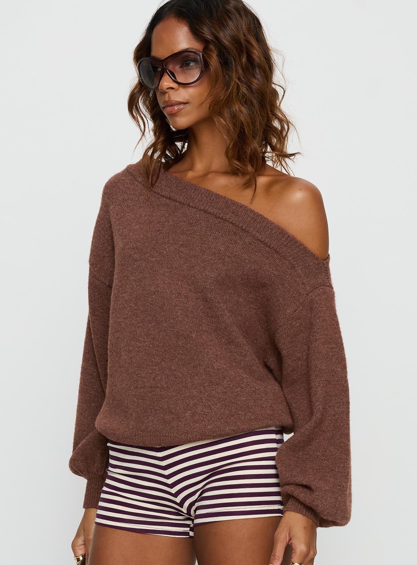side view of model wearing Princess Polly Noble Off The Shoulder Sweater Chocolate 
