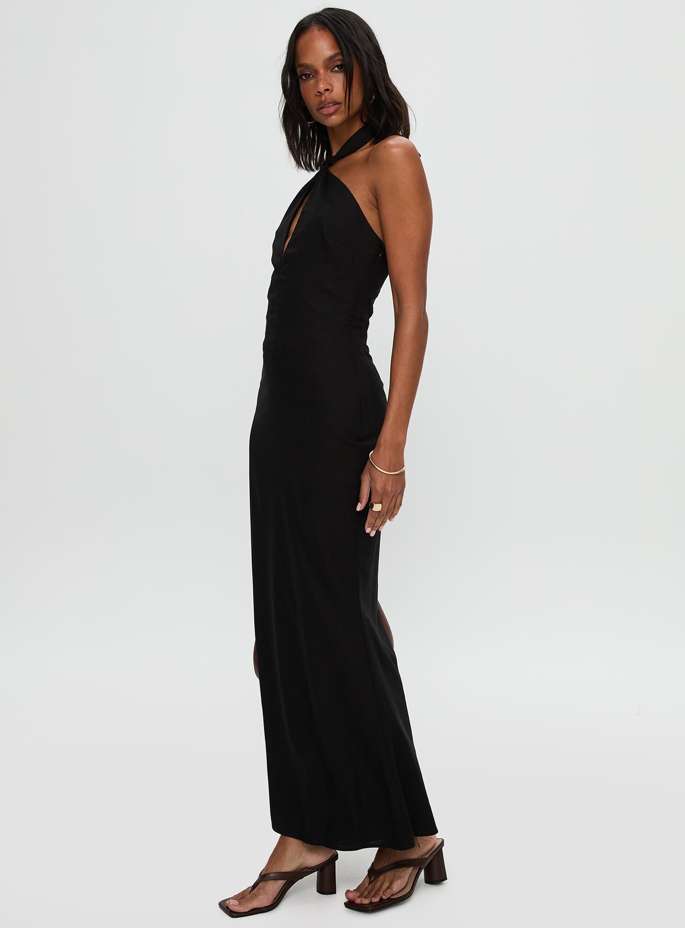 side view of model wearing Princess Polly Rapture Halter Maxi Dress Black Plunger 