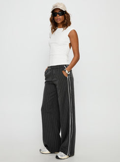 side view of model wearing Princess Polly Knowla Pleated Trouser Pant Grey Pinstripe Mid Rise Pants 