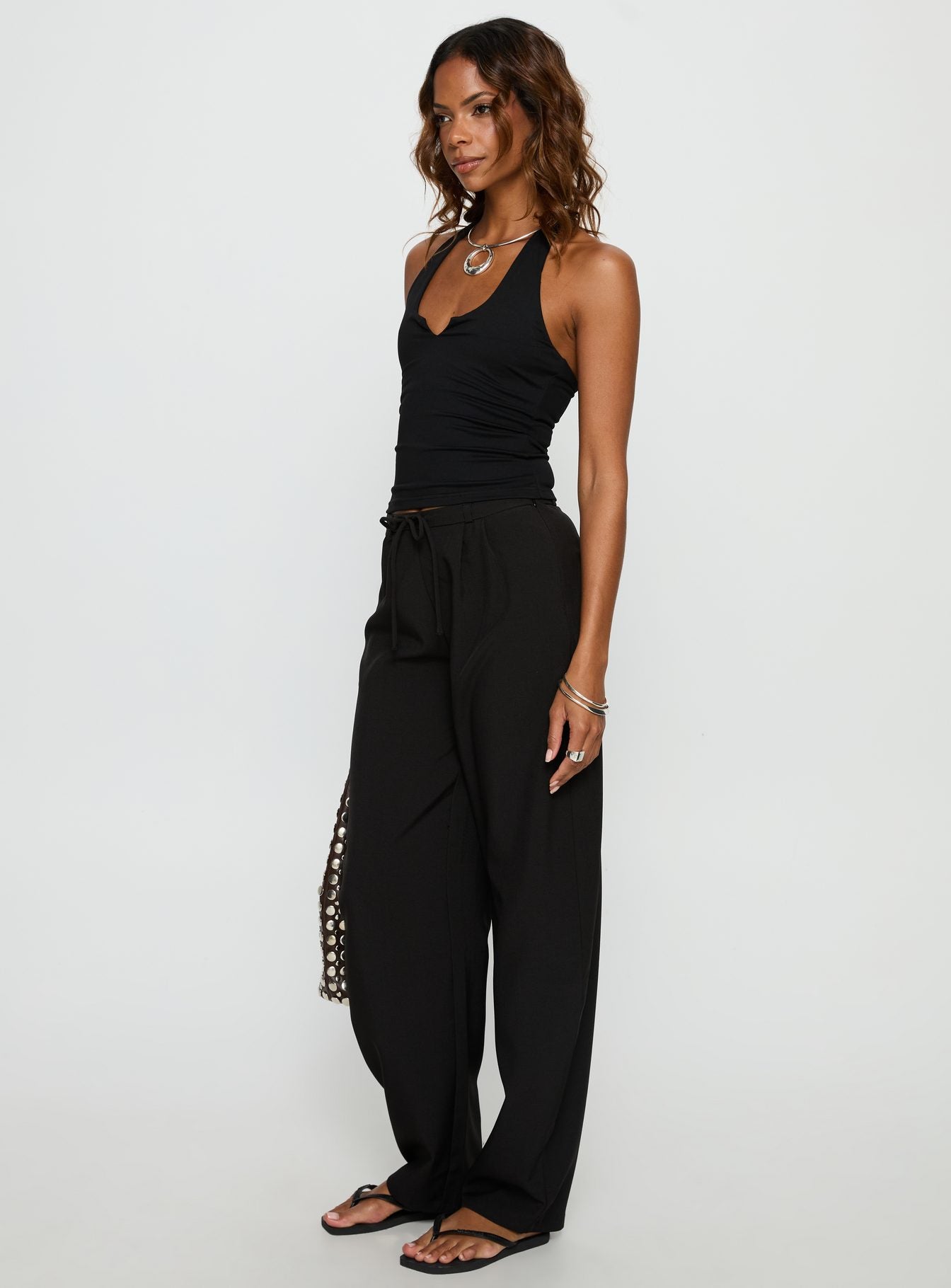 side view of model wearing Princess Polly Triffid Barrel Leg Pants Black High Rise Pants 