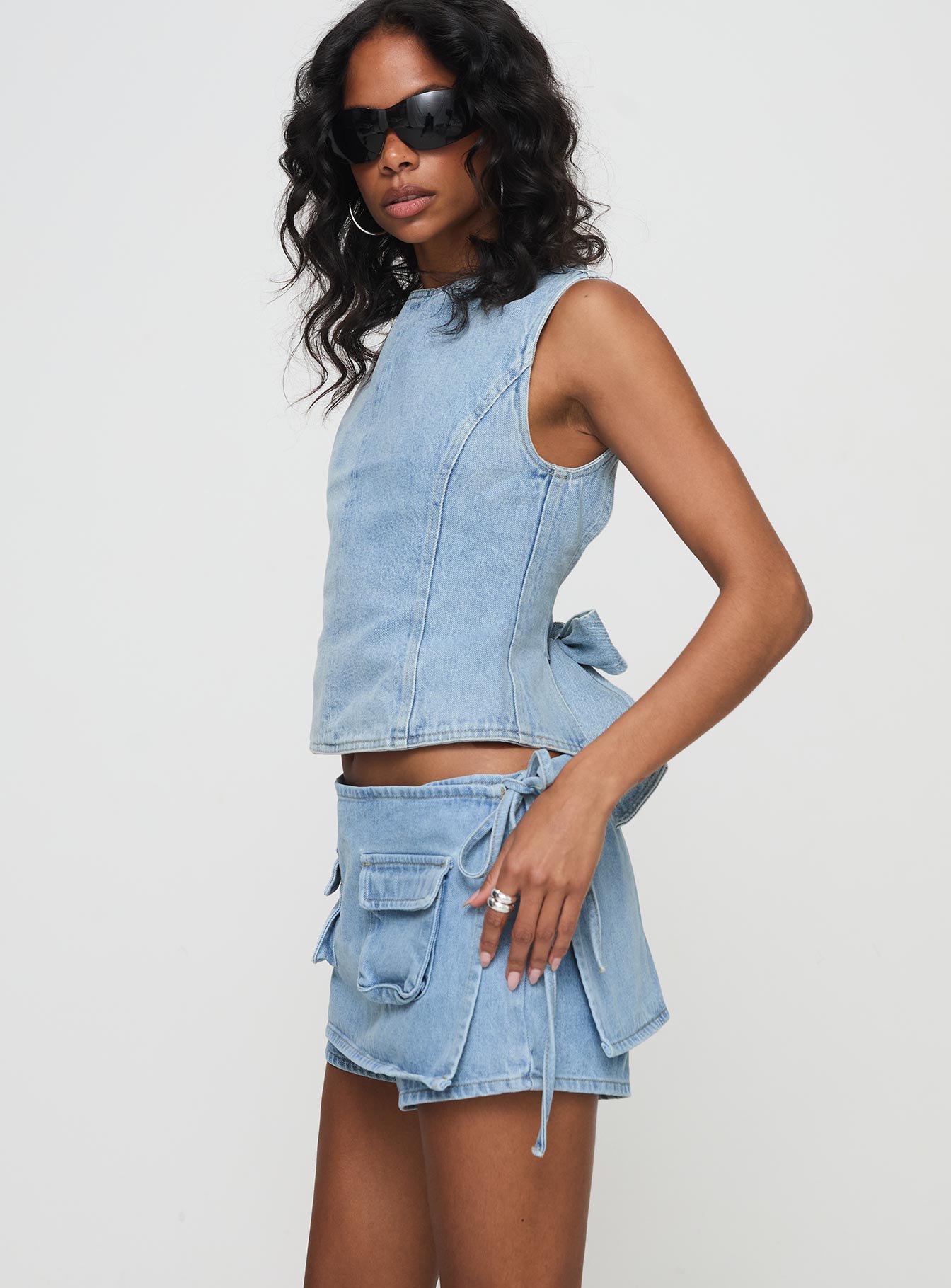 side view of model wearing Princess Polly Countryside Skort Classic Denim High Waisted Shorts 