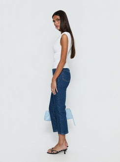 side view of model wearing Princess Polly Cindee High Rise Cropped Jeans Mid Blue Wash High Rise Jeans 