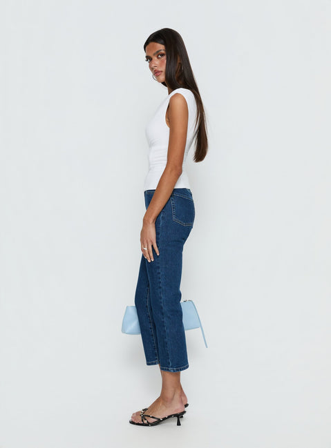 side view of model wearing Princess Polly Cindee High Rise Cropped Jeans Mid Blue Wash High Rise Jeans 