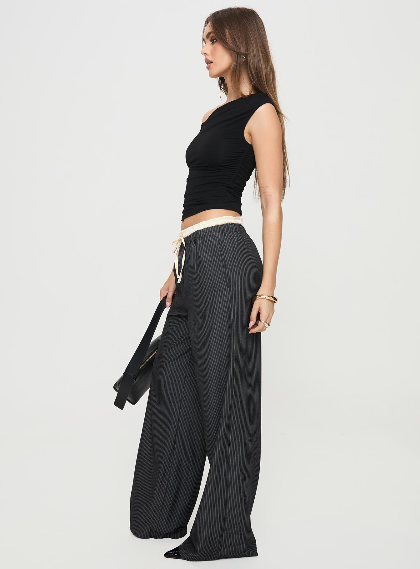 side view of model wearing Princess Polly Seraphic Pants Charcoal Stripe High Waisted Pants 