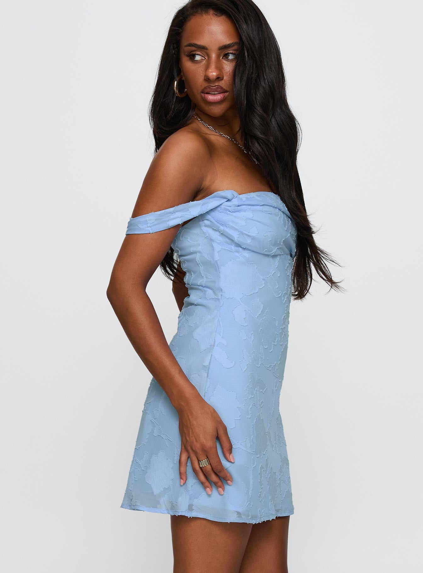 side view of model wearing Princess Polly Zabbarra Off The Shoulder Mini Dress Blue Straight Neck 