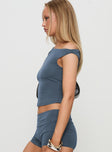 side view of model wearing Princess Polly Marigolde Cupro Top Blue Sleeveless Asymmetric Neckline 