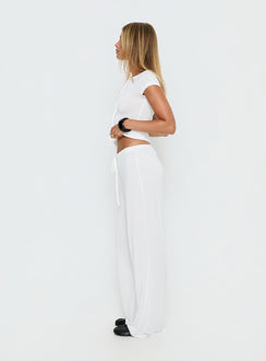 side view of model wearing Princess Polly Gavrielle Jersey Wide Leg Pants White Mid Rise Pants 