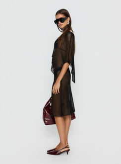   side view of model wearing Princess Polly Luminous Midi Skirt Black 