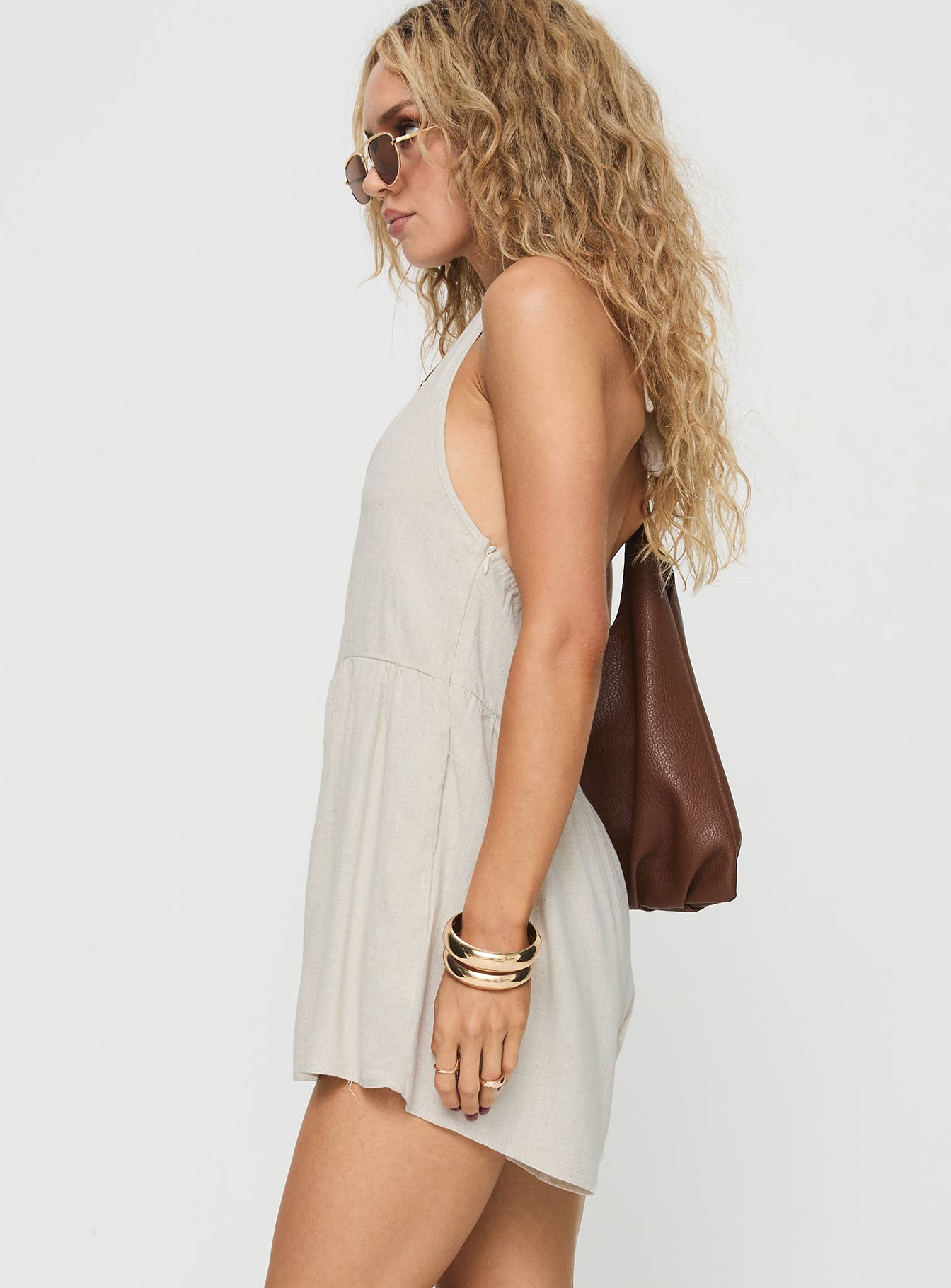 Romper Halter neck tie fastening, scooped neckline, low back, invisible zip fastening at side, twin hip pockets Non-stretch, unlined