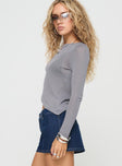 Long sleeve top Knit material, crew neckline, asymmetric hem Non-stretch material, unlined, sheer