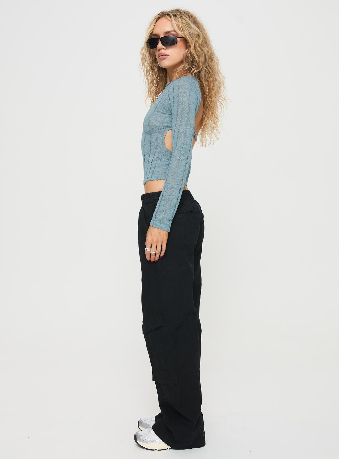 side view of model wearing Princess Polly Chicker Mid Ride Pants Black Low Rise Pants 