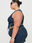 side view of model wearing Princess Polly Edenette Top Mid Blue Wash Curve Sleeveless Plunger 