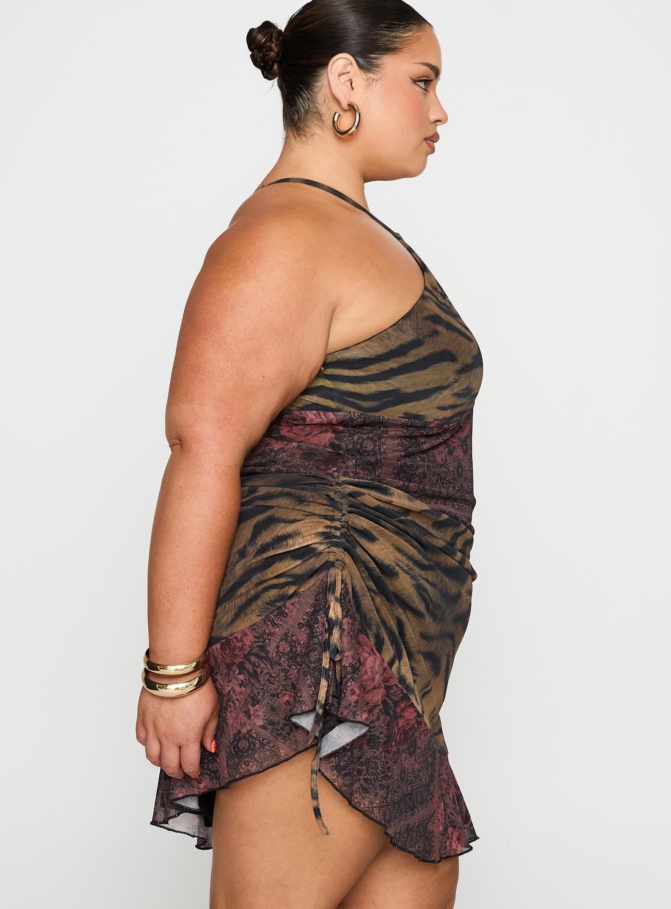 side view of model wearing Princess Polly Syrefena Halter Mini Dress Multi Curve Plunger 