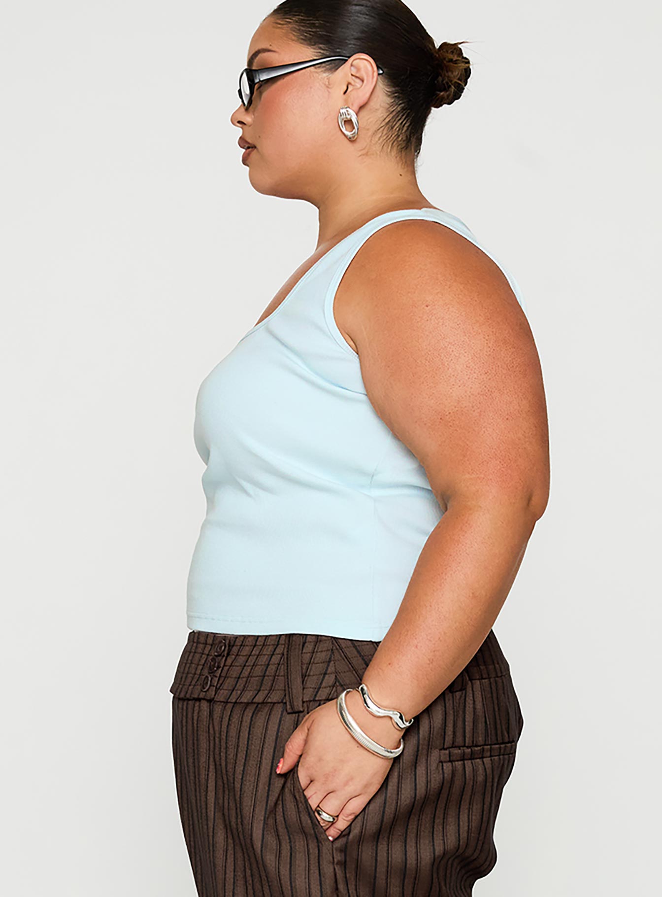 side view of model wearing Princess Polly Baseline Square Neck Rib Tank Top Light Blue Curve Sleeveless Square Neck 