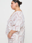 side view of model wearing Princess Polly Sun Dream Shirt Cream / Multi Curve Three Fourth Sleeves Plunger 