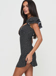 side view of model wearing Princess Polly Moretti Mini Dress Black Polka Dot Sweetheart Neckline 