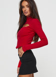 side view of model wearing Princess Polly Cathey Long Sleeve Corset Top Red Full Sleeves High Neck 