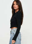 side view of model wearing Princess Polly Jakob Long Sleeve Top Black Full Sleeves Boat Neck 