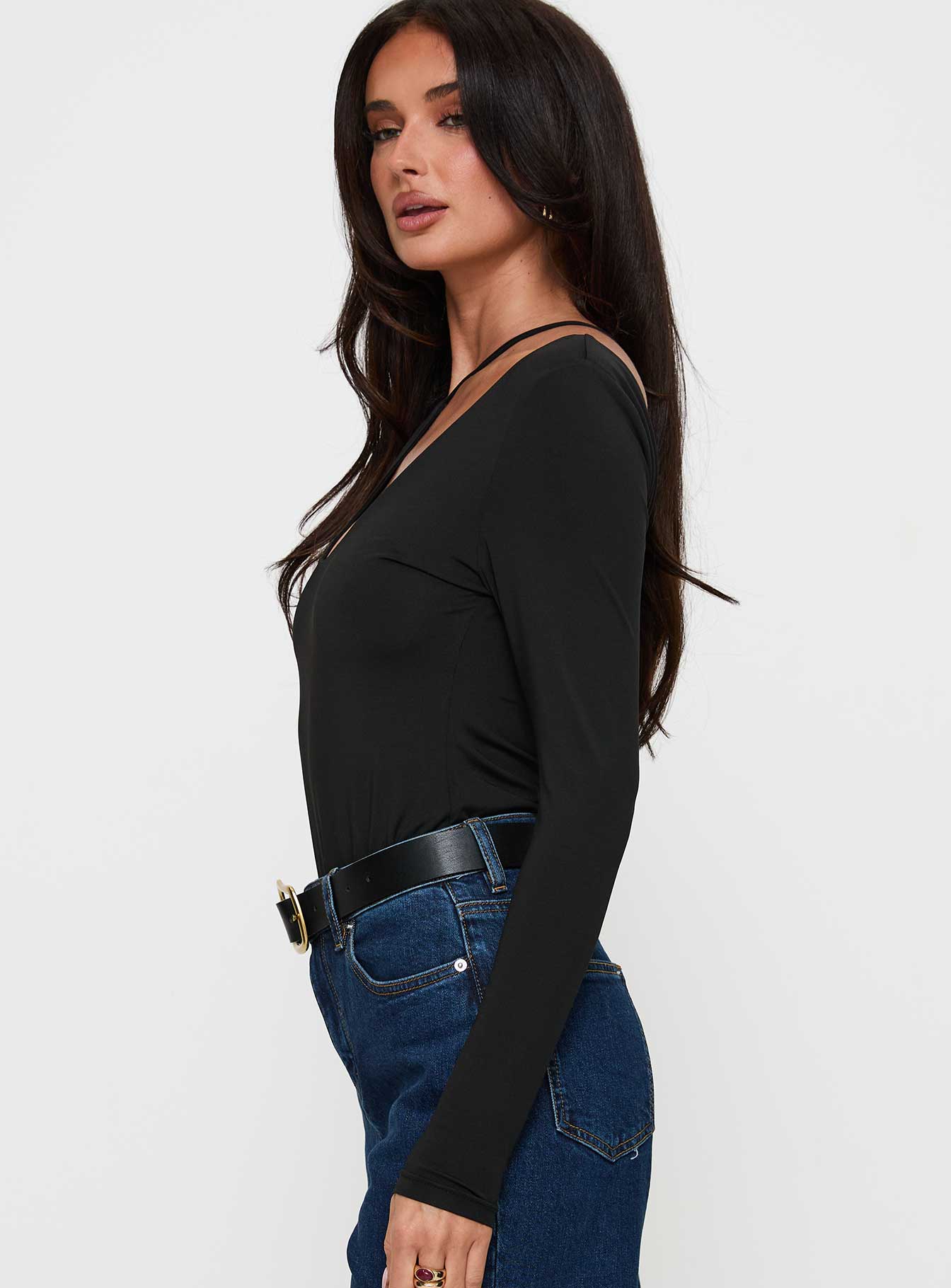 side view of model wearing Princess Polly Play Pretend One Sleeve Bodysuit Black Full Sleeves 