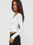 side view of model wearing Princess Polly Passoni Long Sleeve Top White Full Sleeves Asymmetric Neckline 