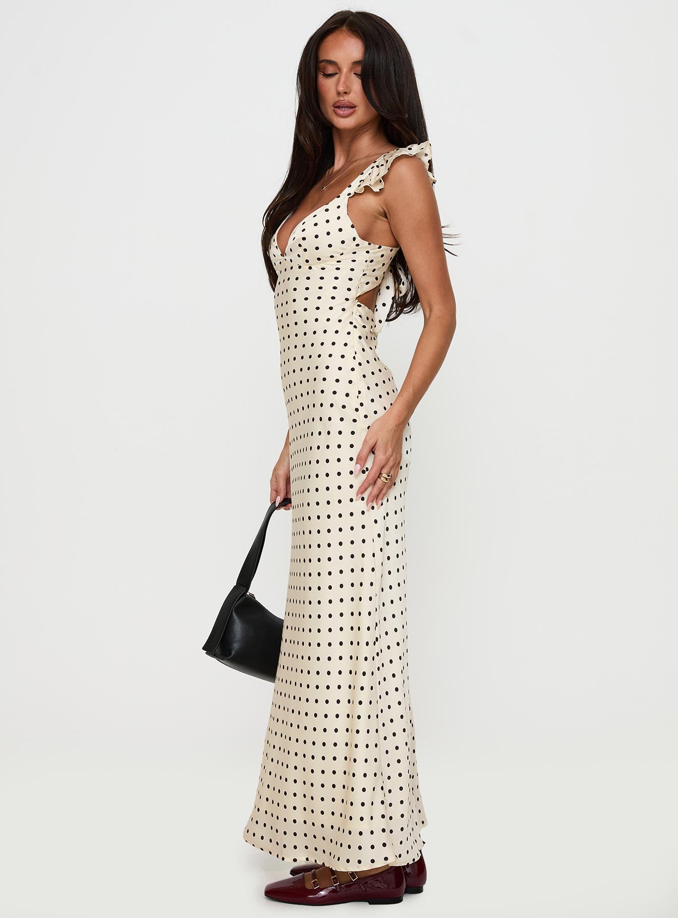 side view of model wearing Princess Polly Odeliah Polka Maxi Dress Cream Plunger 