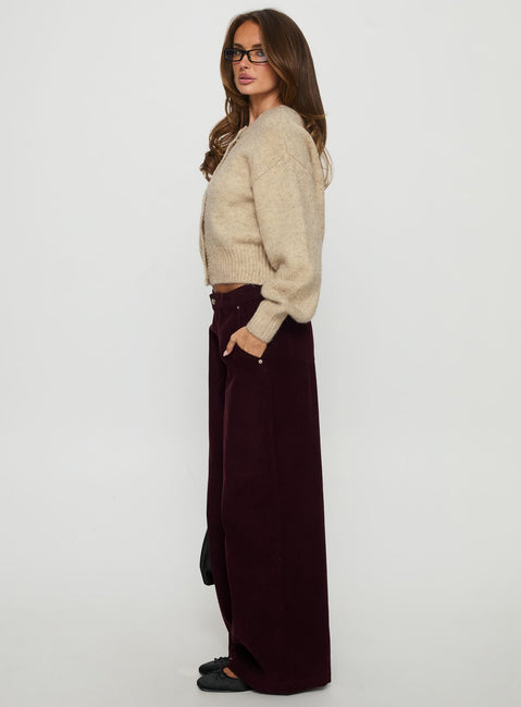 side view of model wearing Princess Polly Jacynda Low Waist Wide Leg Corduroy Jeans Currant Mid Rise Jeans 