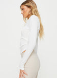 Long sleeve rib knit top Scooped neckline, button fastening at front, subtle pleats at waist Good stretch, unlined  