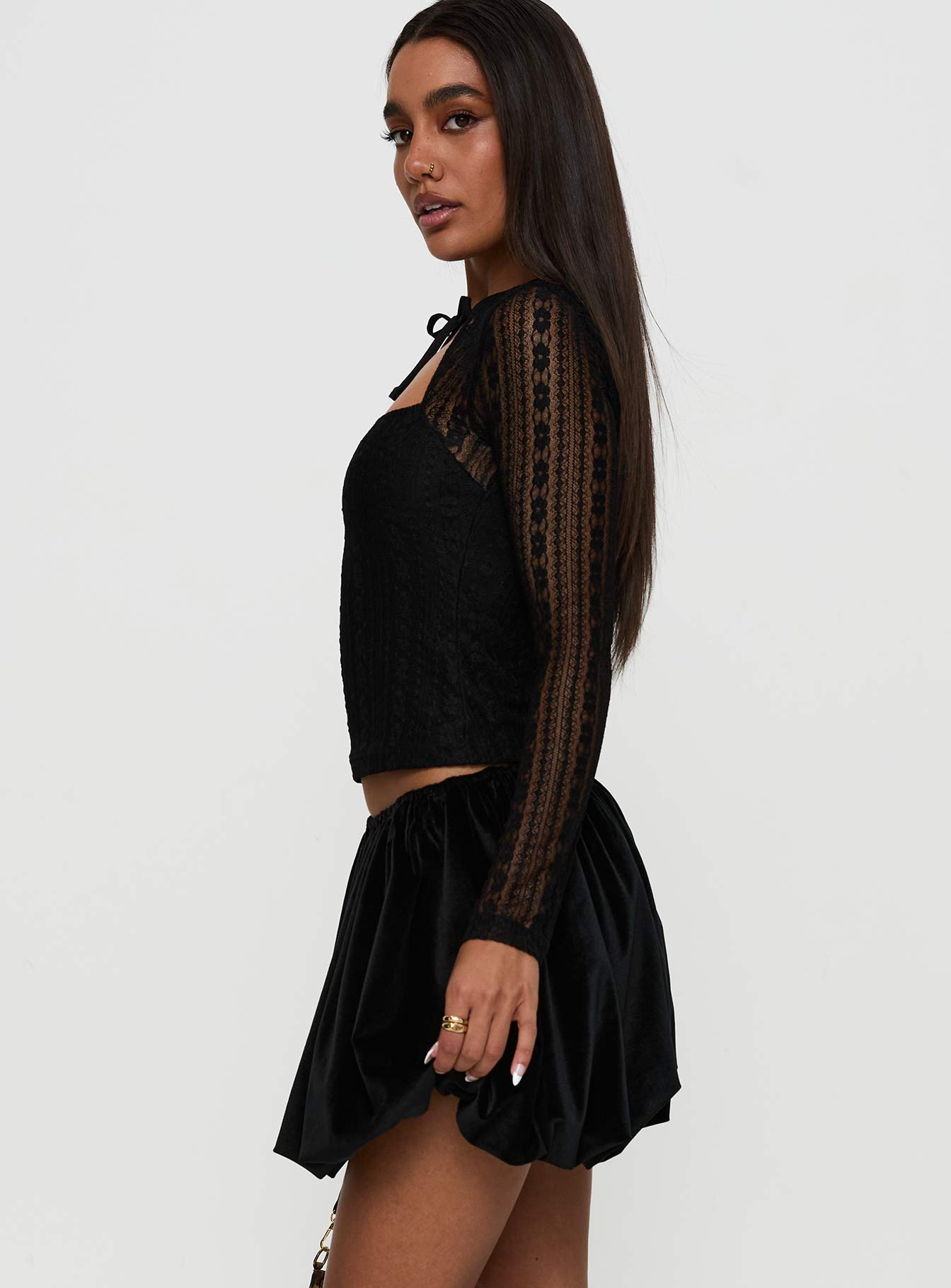   side view of model wearing Princess Polly Georgiana Bubble Hem Mini Skirt Black Mini Skirts 