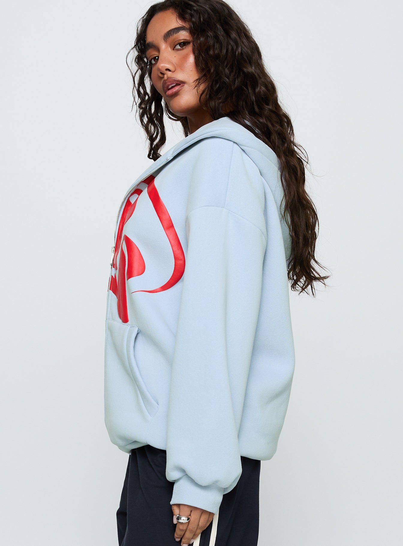 side view of model wearing Princess Polly Starblazer Zip Up Graphic Hoodie Blue / Red Long 