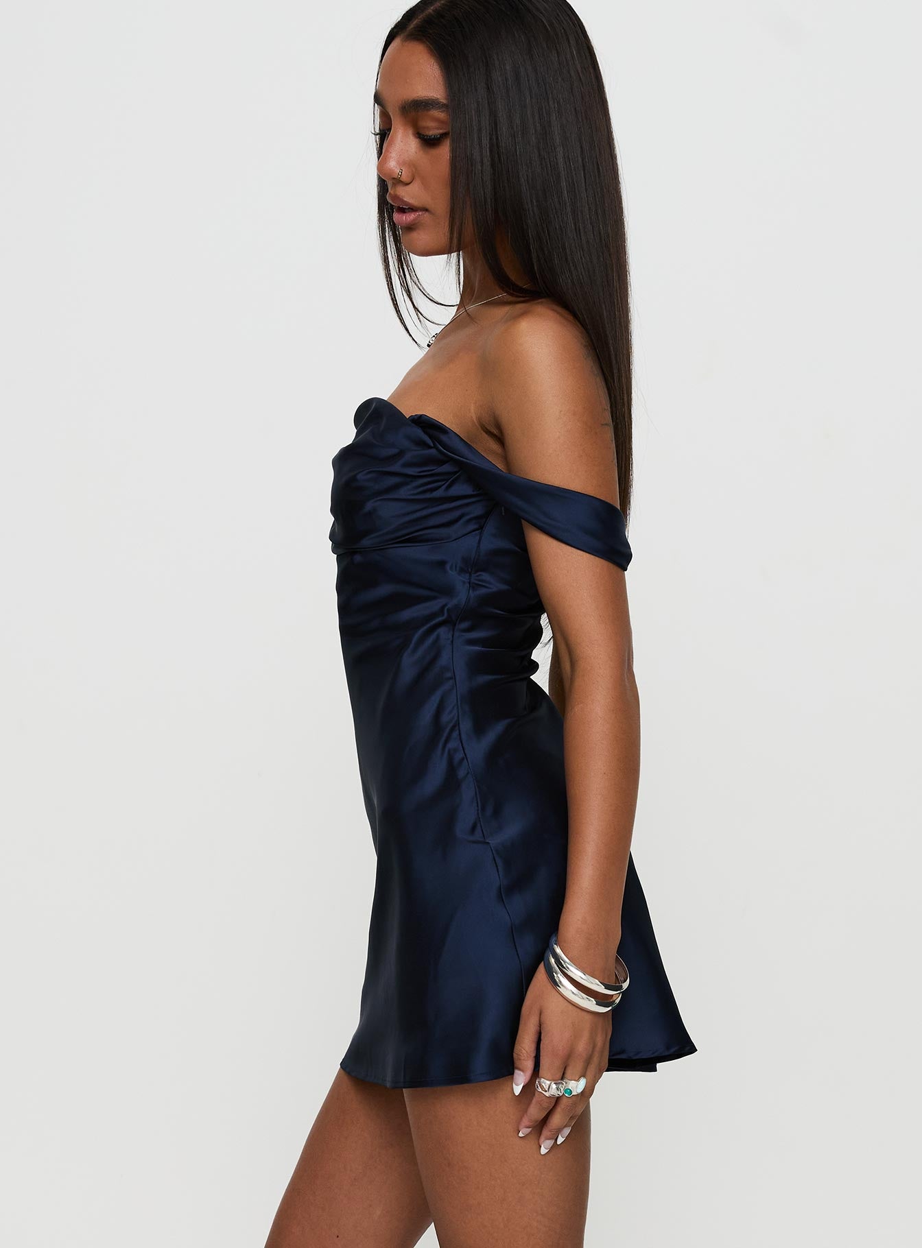 side view of model wearing Princess Polly Zabbarra Off The Shoulder Mini Dress Navy Square Neck 