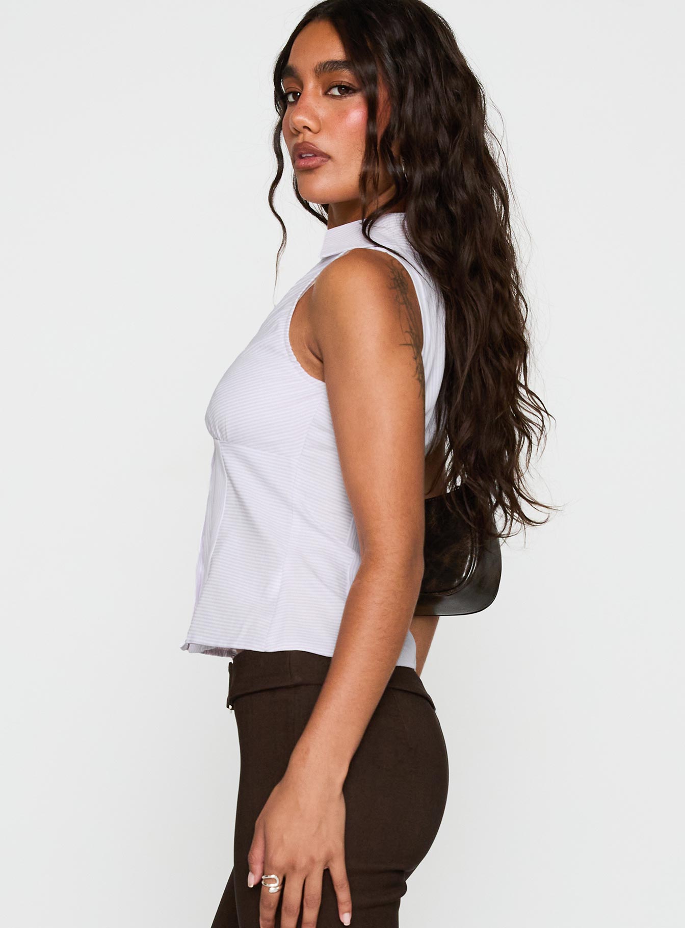 side view of model wearing Princess Polly Mark On Me Sleeveless Top Purple Stripe Sleeveless V-Neck 