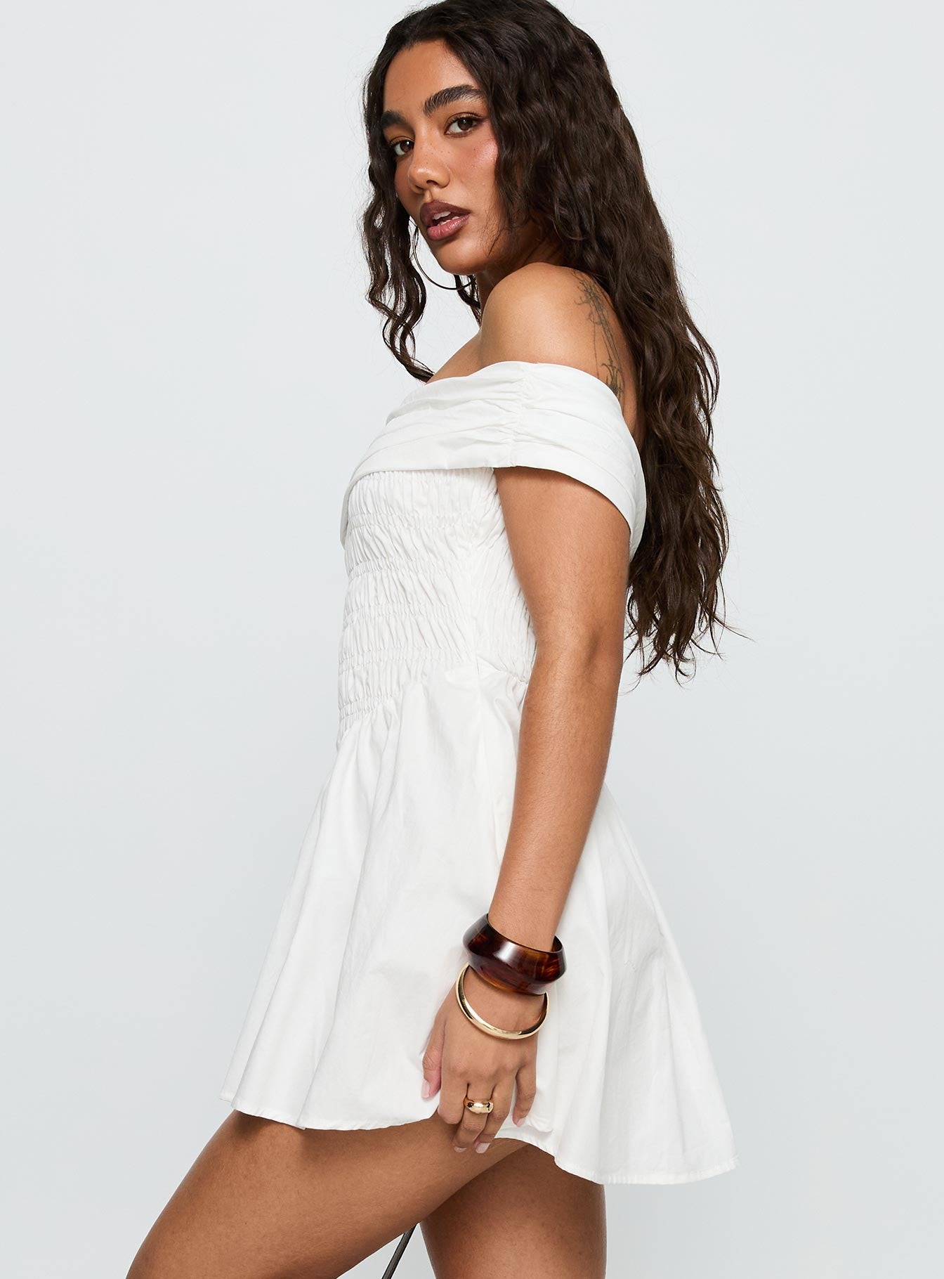 side view of model wearing Princess Polly Fruitful Off Shoulder Mini Dress White Straight Neck 