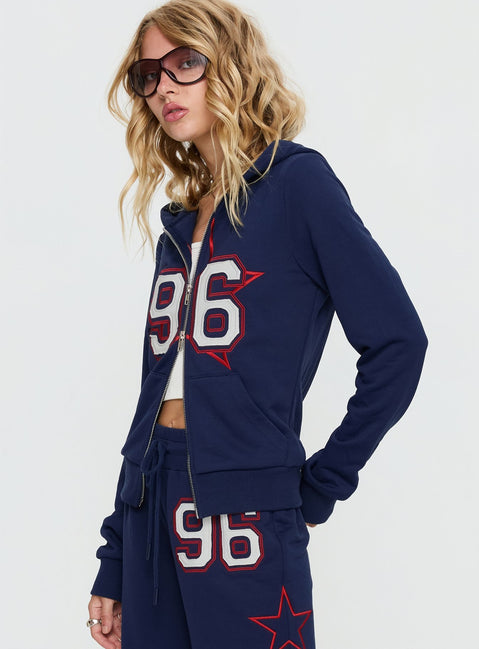 side view of model wearing Princess Polly Kari Distressed Zip Through Top Navy Multi Longline Jumpers 