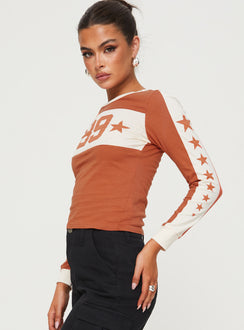 side view of model wearing Princess Polly 99 Roa Long Sleeve Top Orange Full Sleeves Crew Neck 