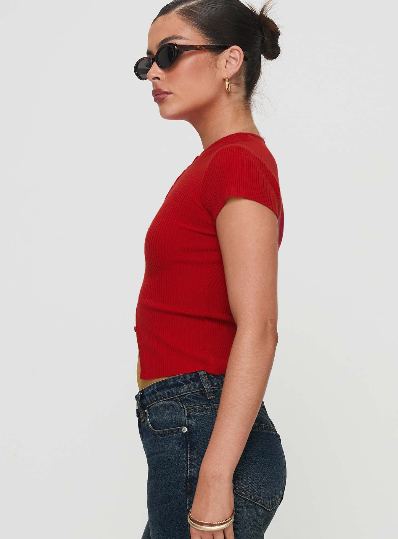 side view of model wearing Princess Polly Suzu Top Red Short Sleeves High Neck 