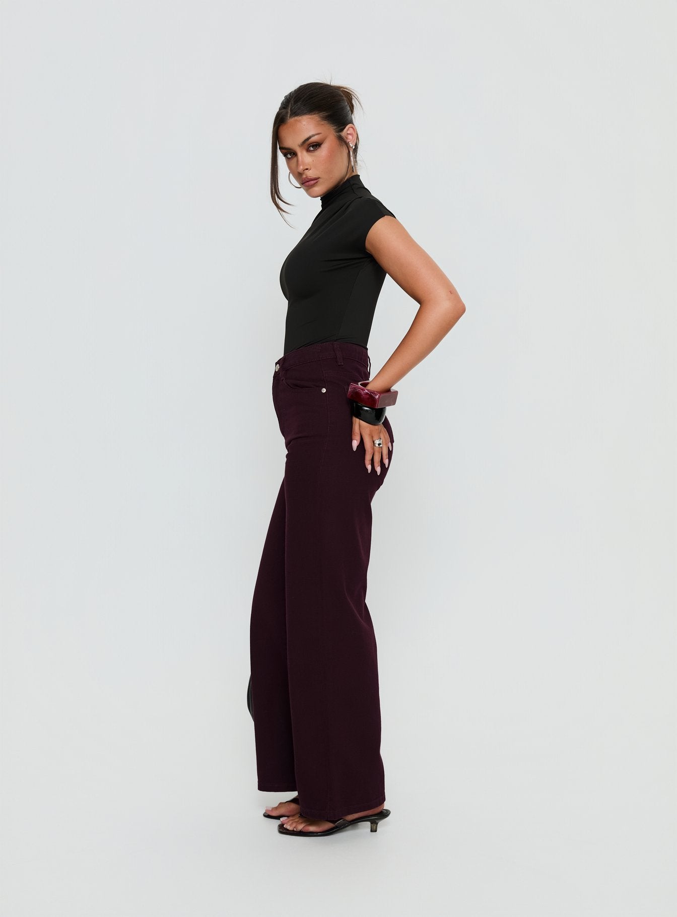 side view of model wearing Princess Polly Nicolo High Rise Straight Leg Jeans Currant High Rise Jeans 