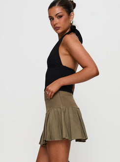   side view of model wearing Princess Polly Feodora Pleat Mini Skirt Khaki Mini Skirts 