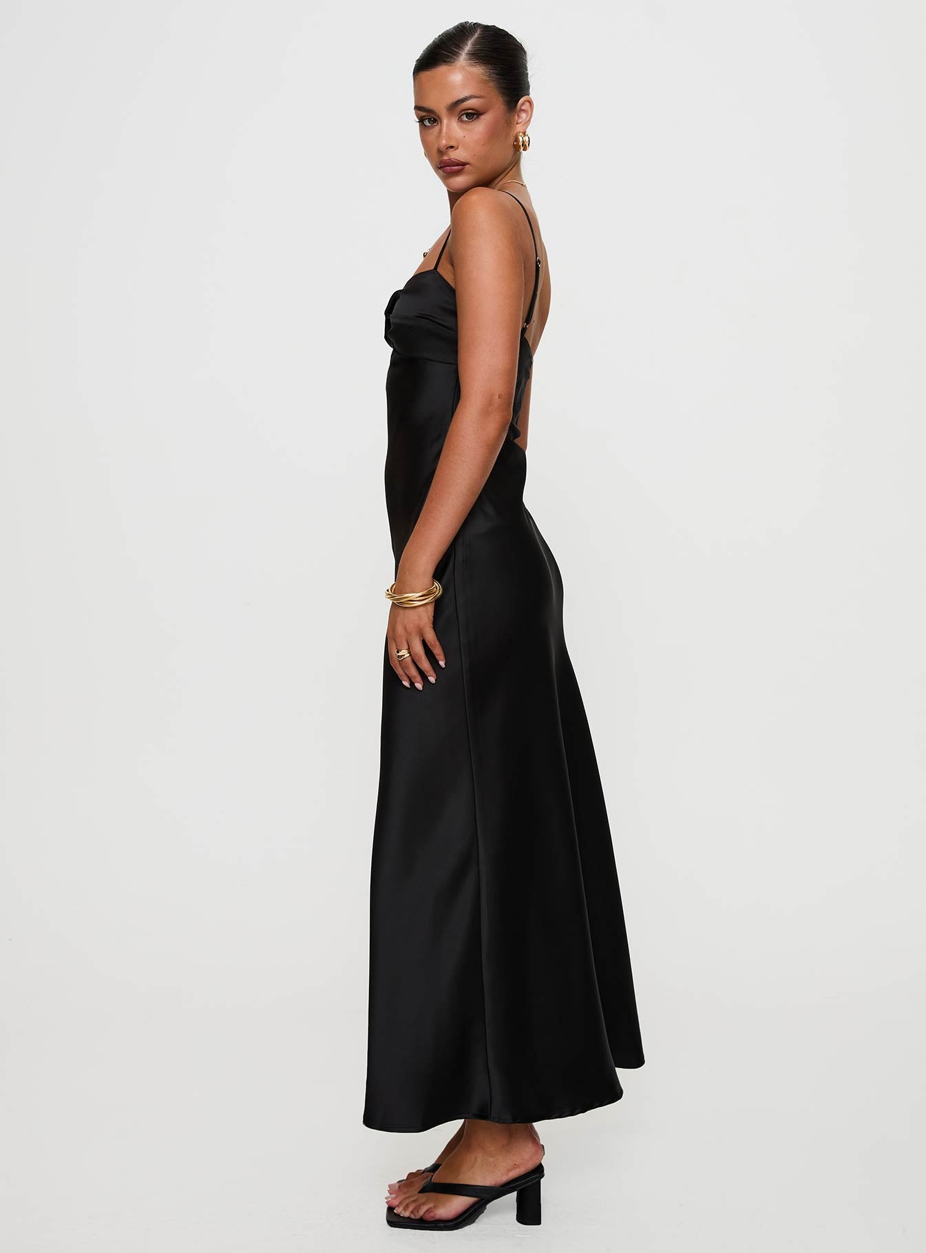 side view of model wearing Princess Polly Blackthorn Maxi Dress Black Sweetheart Neckline 