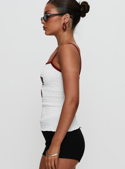side view of model wearing Princess Polly Cherrie Ties Shirred Graphic Top White Sleeveless Square Neck 