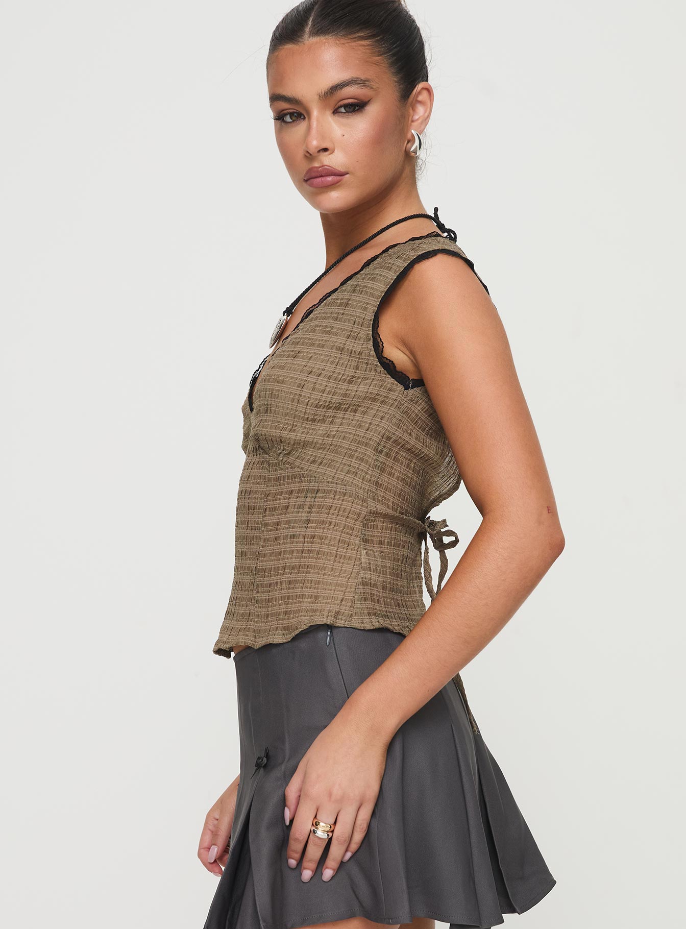 side view of model wearing Princess Polly Hagea Top Olive Sleeveless V-Neck 