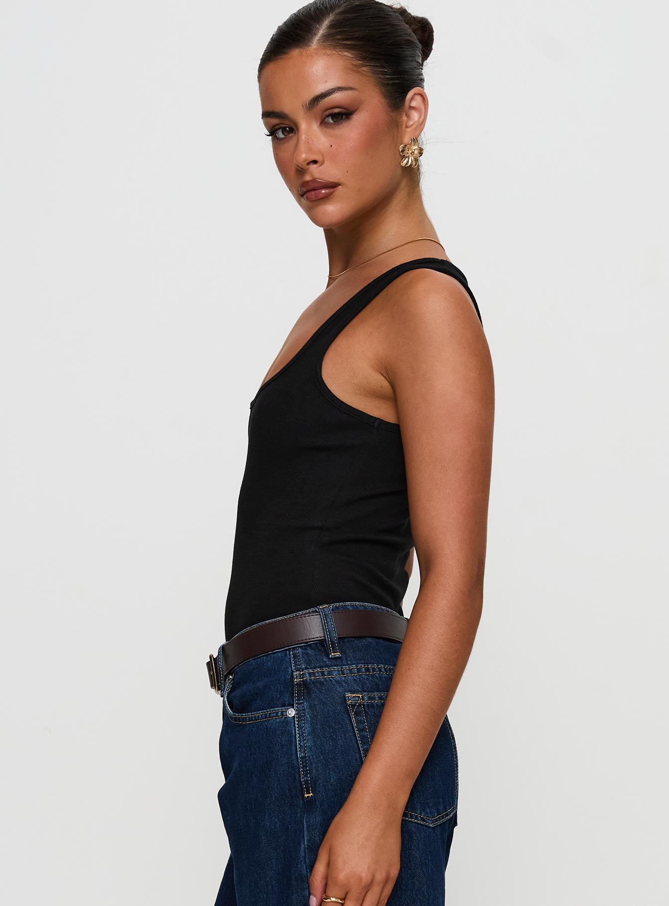 side view of model wearing Princess Polly Baseline Rib Bodysuit Black Sleeveless 