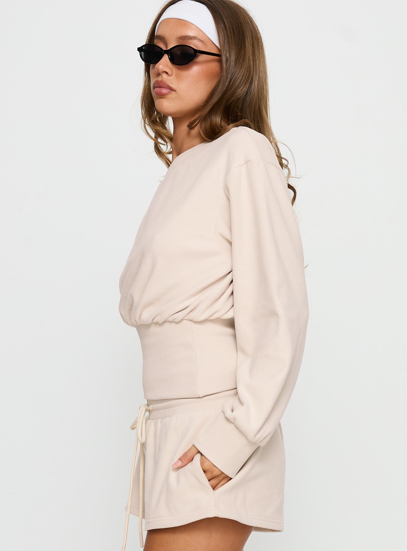 side view of model wearing Princess Polly Cassey Off Shoulder Slouchy Jumper Cream cropped 