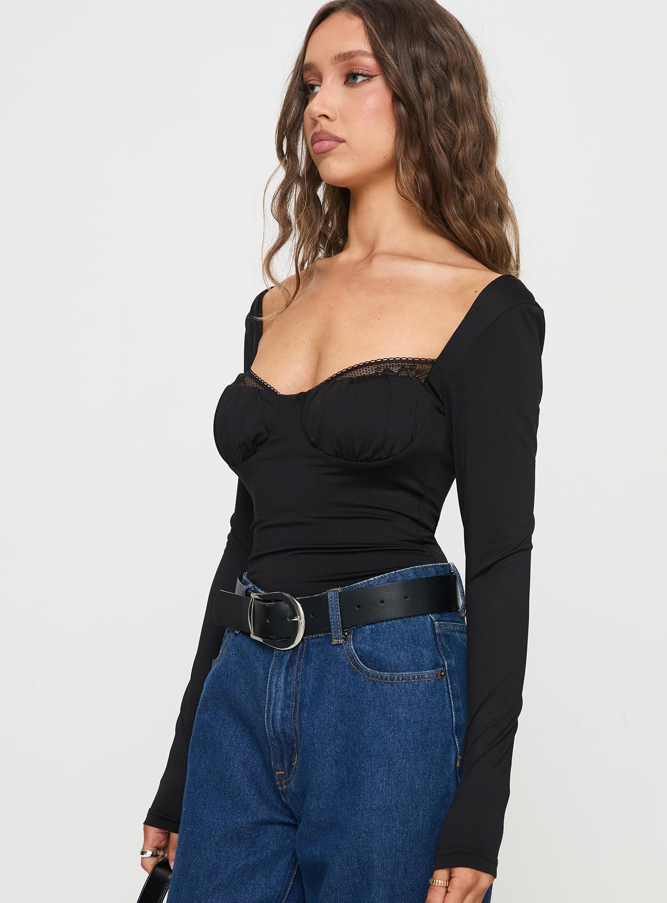 side view of model wearing Princess Polly Peekaboo Long Sleeve Bodysuit Black Full Sleeves Sweetheart 