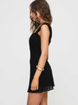 side view of model wearing Princess Polly Lanchester Mini Dress Black Petite Square Neck 